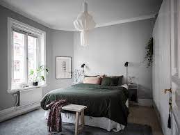 Soft lighting and pale accents create a calming effect perfect for dreaming in this gray and yellow bedroom. Pin By Susan Balaban On Home Gray Bedroom Walls Grey Green Bedrooms Warm Grey Walls