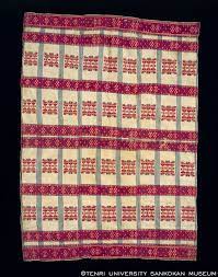 排灣族士文部落女子喪服用的人頭紋浮織背披衣 tenri periodic table