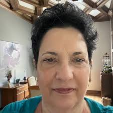 Hi All, trying to come up with ideas for stairs in the front of this house.  The house overlooks Lake Ontario which is about 50 ft. away. Can anyone  handy with AI