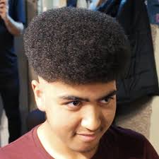 Let your locks bounce in a nicely shaped cut, emitting confidence and style. Afro Curly Top Low Skin Fade Haircut For Men Video Regal Gentleman