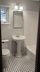 Black And White Ceramic Tile Flooring Gray Walls Black And White Mosaic Tile Floors Simple Pedestal Sink No Wall Tile Tile Bathroom Traditional Bathroom Bathroom Floor Tiles