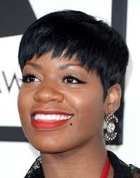 The phrase free yourself, a tootsie roll candy, her mother's name diane, two dollar signs, a rosary bead necklace. Fantasia Barrino Pixie Fantasia Barrino Short Hairstyles Lookbook Stylebistro