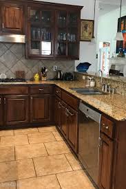 Before And After Of Our Kitchen Update Grey Cabinets With A Navy Island And White Quartz Is Just The Clean Updated Kitchen Grey Cabinets Grey Kitchen Cabinets