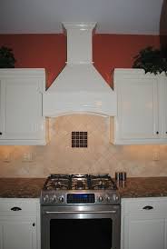 There is no feeling of depression.source. Decorative Range Hood Soft White Cabinets Travertine Backsplash Traditional Kitchen Other By Hatchett Design Remodel Houzz