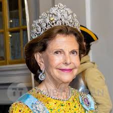 Queen Silvia during the celebration of the 50th coronation anniversary of  King Carl Gustav of Sweden. Typically, Queen Silvia wears her hair in a  “set” style, but I believe she broke out