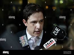 Samuel Johnson emerges from Sydney's Downing Centre Courthouse with his  girlfriend Sarah Hallam. Johnson, the former 'Secret Life Of Us' star, 29,  has escaped conviction for a drunken assault in which he