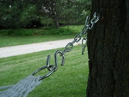 A hammock hanging nearby is an appealing call to leisure and relaxation. Vivere Chain Chain Hanging Kit For Hammocks Hammock Town