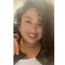 Home plate umpire Jarodd Goedel ties the shoe of Eric Rodriguez of the team  from Panama during the Little League World Series in South Williamsport.  DAVE KENNEDY/Sun-Gazette