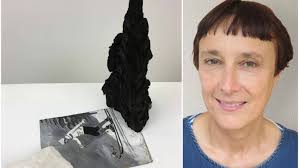 Artist reworks charred remnants of school fire to help fund rebuilding