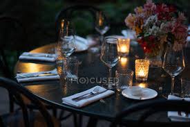 Maybe you would like to learn more about one of these? Setting Table Decorated With Candles And Flowers At Night On Backyard Wooden Wine Glasses Stock Photo 214403356