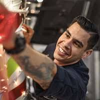 Personnel Specialist 3rd Class Aaron Ingram helps a customer in the  personnel office of the aircraft carrier USS Theodore Roosevelt (CVN 71).