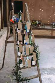 Rustic Wedding At Yoghurt Rooms In Sussex With Diy Decor Wedding Table Plan Wine Theme Wedding Wedding Table