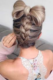 Braids (also referred to as plaits) are a complex hairstyle formed by interlacing three or more strands of hair. Picture Of A Fun Braided Updo With A Large Hair Bow On Top For A Whimsy Look