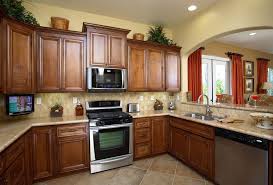 How is my dishwasher attached? Traditional Kitchen With Inset Cabinets U Shaped Complex Granite Counters Under Cabinet Tv Mount Stone Tile Kitchen Plans Kitchen Remodel Kitchen Design
