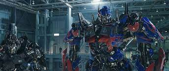 Template:quote autobots roll out optimus prime is the main protagonist of the transformers film series and the leader of the autobots, the last prime, and the adopted brother of the decepticon leader megatron. Opand Ironhide Optimus Prime Wallpaper Transformers Transformers Optimus Optimus Prime Wallpaper
