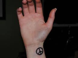 36 classic peace symbol wrist tattoos design; Peace Tattoo Wrist 24 Relaxed Peace Sign Tattoos For 2013 Peace Sign Tattoos Tattoos Peace Tattoos