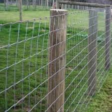 Except for the corners, the posts are simple straight rods that even have a special tool designed to drive them into the ground. Wire Fence For Construction And Field Colonial Construction