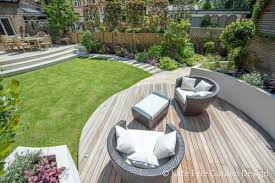 Slate paving from the french doors takes you round the. Garden Design In Wandsworth By Kate Eyre