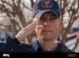 Tech. Sgt. Steven Conine, inaugural parade street cordon member, salutes at  Joint Base Andrews, Md., Jan. 12, 2017. He and many other JBA members  attended the cordon rehearsal, where they practiced marching,