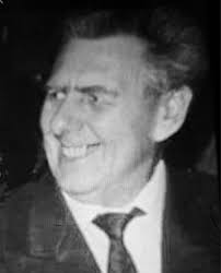 A view looking north from Leeds Bridge onto Briggate in November 1949. The  trams include the number 11 to Gipton Estate and number 6 to Meanwood.