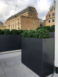 The geometric design suits the clean lines of contemporary architecture and planting, combined with a superb finish these planters are a very popular choice for any modern garden. Fibreglass Trough Planters From Potstore Co Uk