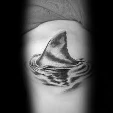 Great for an ocean or beach theme. 20 Shark Fin Tattoo Designs For Men Masculine Ink Ideas Shark Tattoos Tattoos Tattoos For Guys