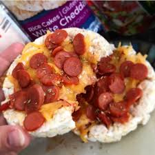 They rice cakes dispel the myth that that rice cakes are flavorless, cardboard discs. 2 White Cheddar Rice Cakes With Some Low Carb Pizza Sauce Shredded Cheddar Mini Turkey Pepperonis Sprinkled Healthy Snacks Recipes Low Carb Pizza Rice Cakes