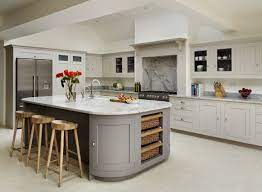 Shaker style doors and drawer fronts are available in a vinyl wrap. A Lovely Neutral Colour Palette In This Modern Kitchen This Is The Harvey Jones Shaker Kitchen With Curved Cupboa Kitchen Design Modern Kitchen Kitchen Layout