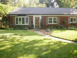 Look through photos of brick ranch style homes and see what they done to the front yard. The Typical Red Brick Ranch Red Brick House Brick Ranch Houses Ranch House Landscaping
