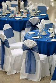 white chair covers with blue organza sashes and matching blue table overlays 45th wedding anniversary wedding anniversary decorations wedding anniversary party
