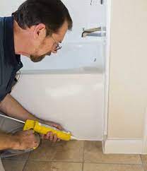 Silicone caulk has good adhesive properties and will not only seal cracks but also hold trim pieces to the wall. Caulking A Shower Or Tub On The House