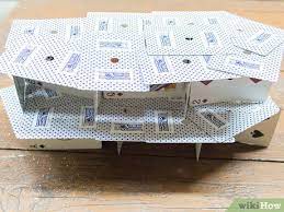 You can go two ways with this one, you can add another triangle and top it with one card laying on top (1),or you can lean 2 more cards on the open sides of the triangle (2). 3 Ways To Build A House Of Cards Wikihow