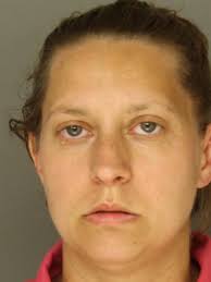 Woman charged after grabbing steering wheel of moving car