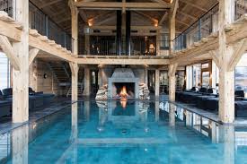 A Sensational Barn Inspired Spa With Fireplace And Indoor Outdoor Pool Modernpoolandspa Luxusschwimmbader Schwimmbad Designs Moderne Pools