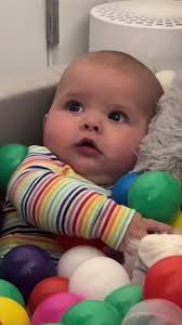 Exploring a Ball Pit with an Adorable Baby
