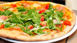 Handful of beers on tap, wide array of menu items. Making Homemade Pizzas In The Rustic Naturals Wood Fired Pizza Oven