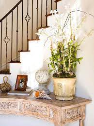 A console table is a long piece of furniture that's about the same height as a dining table or desk. Contemporary Style Staircase Decor Foyer Decorating Curved Wall Decor
