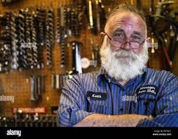Retired U.S. Air Force Master Sgt. Keith Robertson, Auto Skills Center  manager, poses for a photo in his shop at Cannon Air Force Base, N.M., June  29, 2018. Robertson has been working