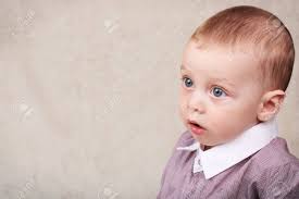 Beautiful Baby Boy Wearing Collared Shirt Looking Into Copy Space With His Large Blue Eyes And Short Brown Hair Stock Photo Picture And Royalty Free Image Image 71918800