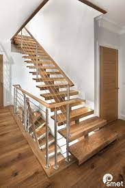 Modern Contemporary Staircase With A Solid French Oak Central Spine And Horizontal Stainless Steel Tub Stair Railing Design Modern Staircase Staircase Handrail
