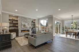 The light hardwood floor contrasts with the dark colors in the furniture and the wooden ceiling. Dark Floors Vs Light Floors How To Choose Rhodium Floors