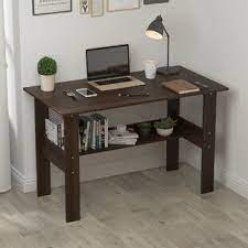 For larger families with small children, a sturdy wood accent table is a great choice. Wood Top Desk Wayfair