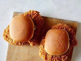 First you cut up a pork tenderloin into 4 parts. Pork Tenderloin Sandwich Spoon Fork Bacon