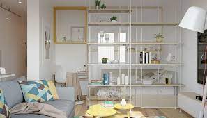 das bett wird mit einem regal vom wohnzimmer getrennt small apartment interior apartment design studio apartment design