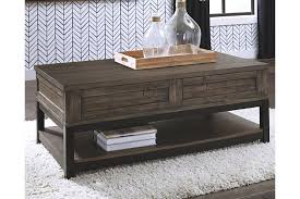 I hide all my candy and stuff i don't want my kids to know about under the lift top and they have no idea about it lol! Johurst Coffee Table With Lift Top Ashley Furniture Homestore