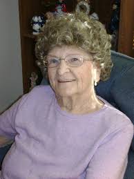 My grandmother, Nora Johnson, in front of the Braniff plane at Truax Field,  Madison, leaving for Arizona in 1945 to meet her husband Dewey Johnson.