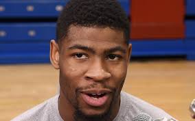 Final Four: KU Jayhawk Mitch Lightfoot helps Silvio De Sousa