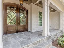 Flagstone Porch And Beautiful Doors By Horizon Custom Builders Stained In Minwax Jacobean Ideas For Updating Porch Doors Stone Porches Porch Flooring