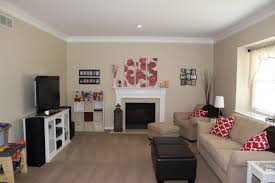 My Own Family Room Sherwin Williams Softer Tan I Love It With The Red Accents Paint Colors For Living Room Living Room Colors Tan Living Room