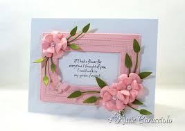 Stick the three dried pansy flower heads, equally spaced, in a line on the front of a blank card using a small spot of glue delicately applied to the back with a toothpick. Framed Die Cut Paper Flowers Card Kittie Kraft